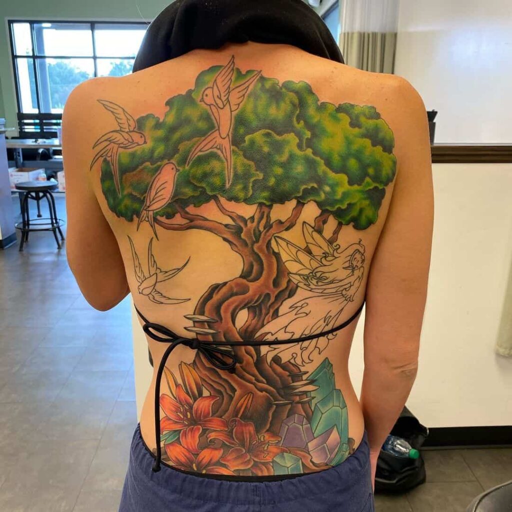 Gorgeous Nature Inspired Green Tattoo Over Back