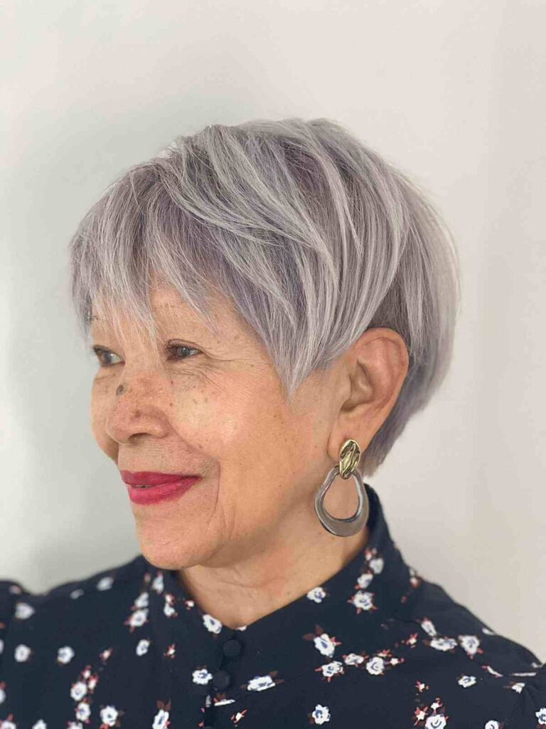 long pixie cut with longer bangs for grey haired 60 year olds