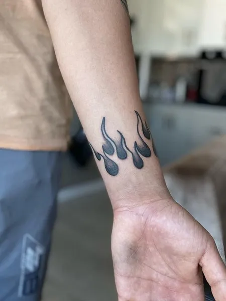 Flames On Wrist Tattoo