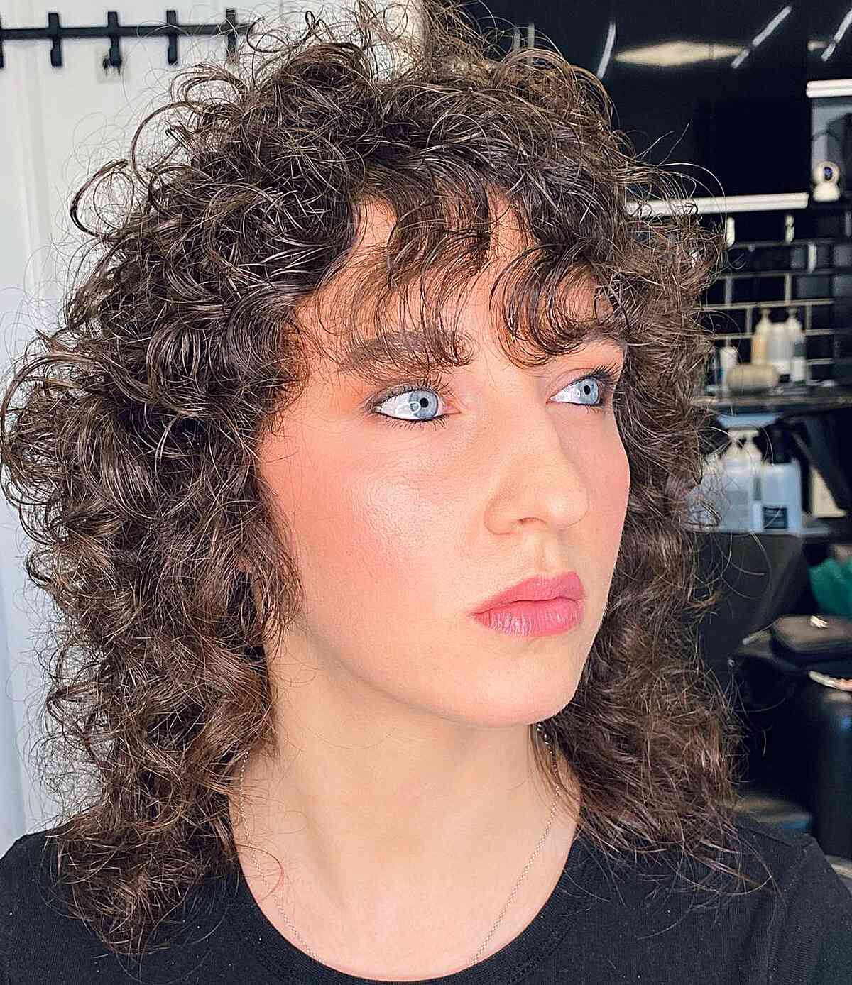 80s curly mullet with wispy bangs