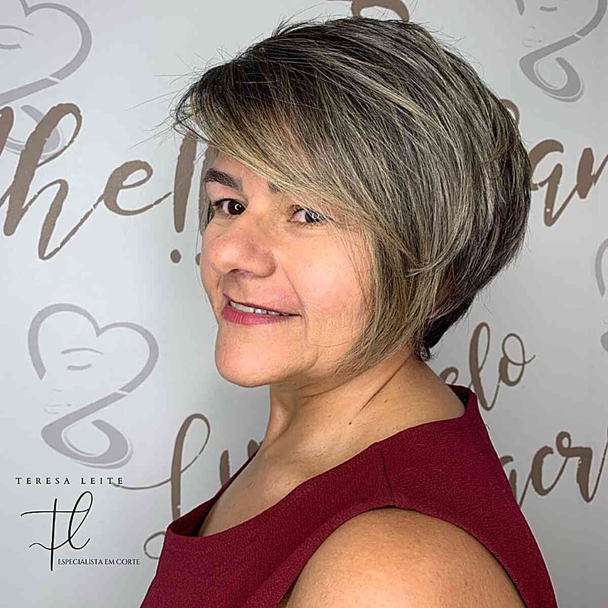 graduated short pixie bob hair with swooping side bangs for middle aged ladies