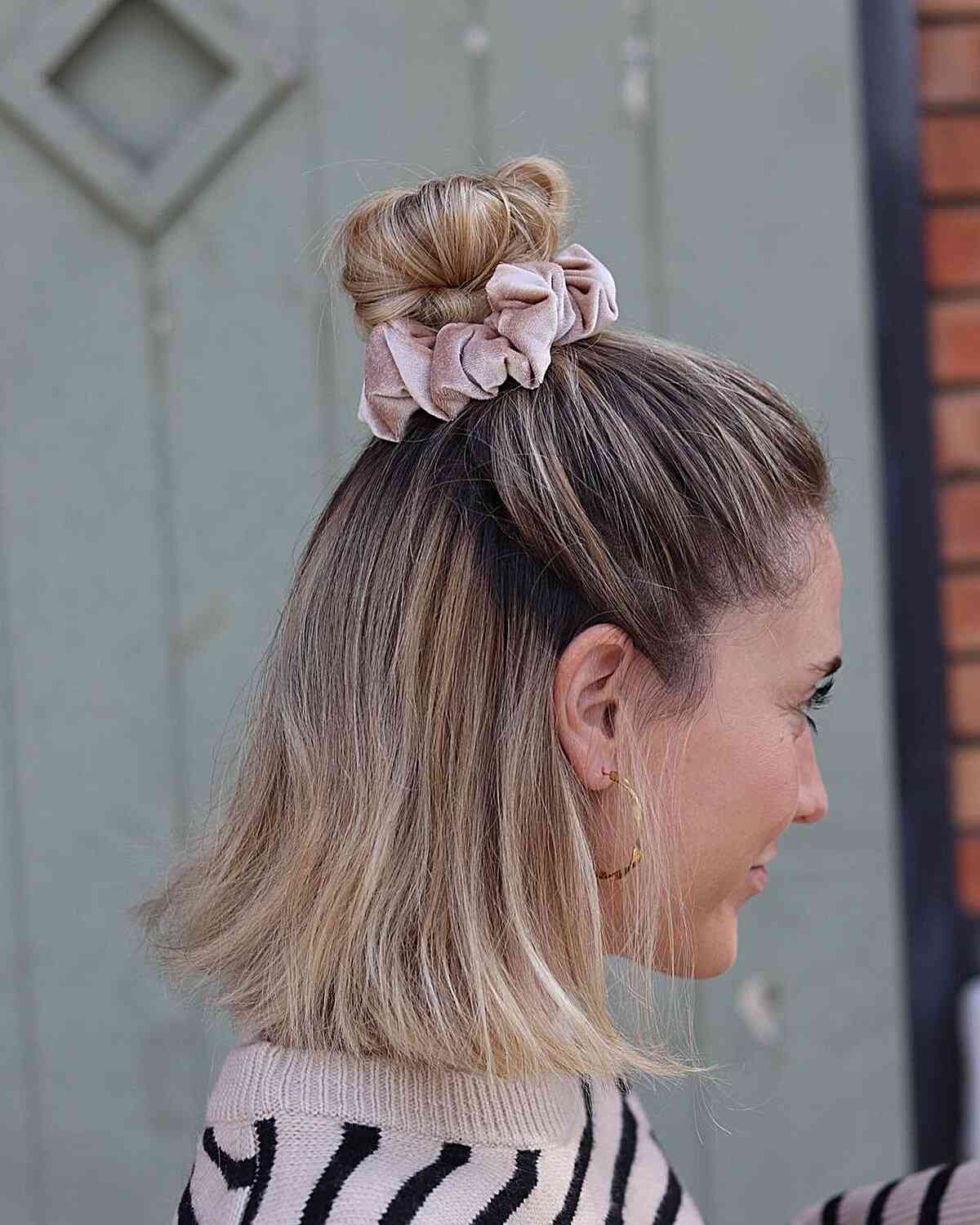 half up bob updo with 80s scrunchie