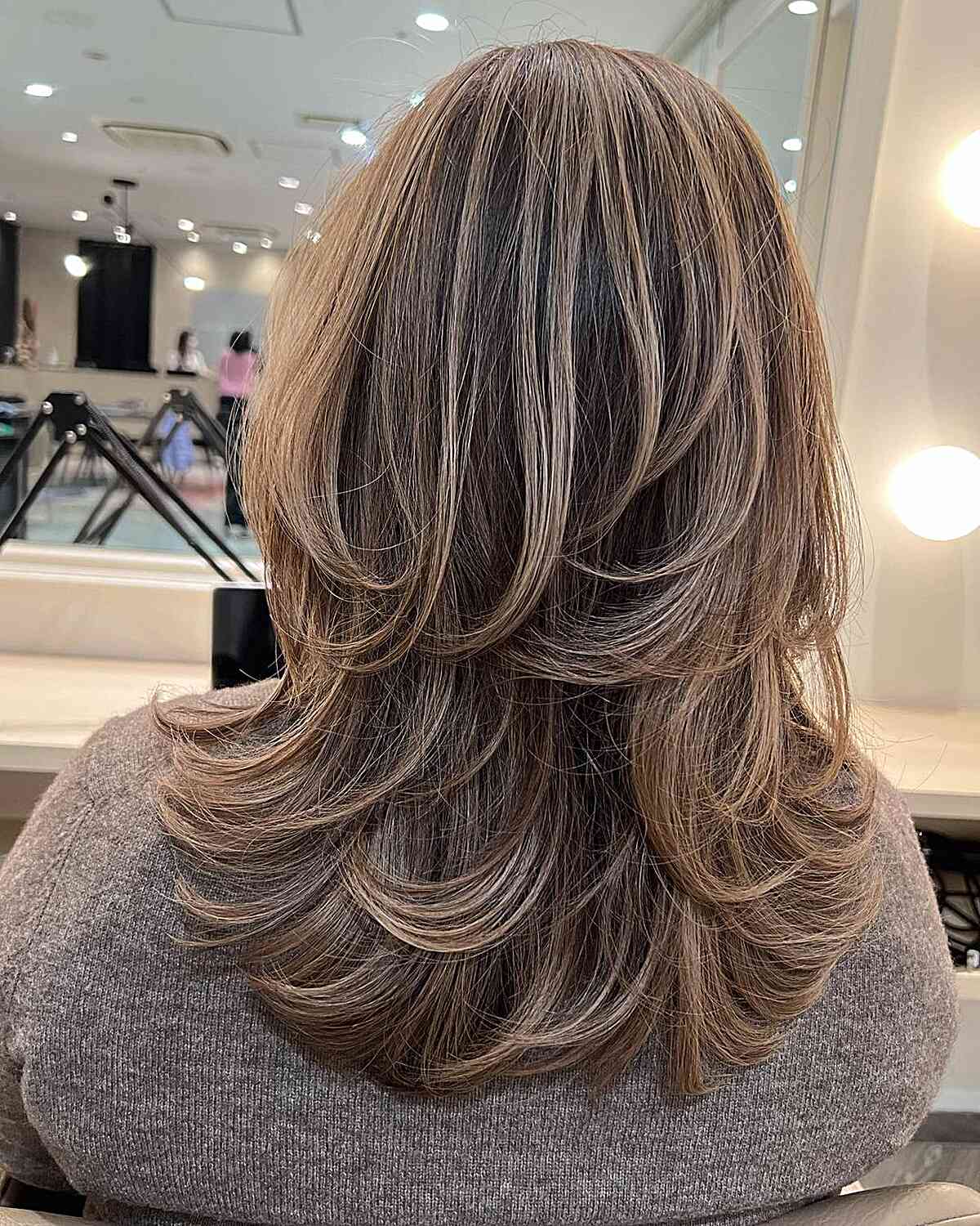 medium layered octopus butterfly cut with highlights