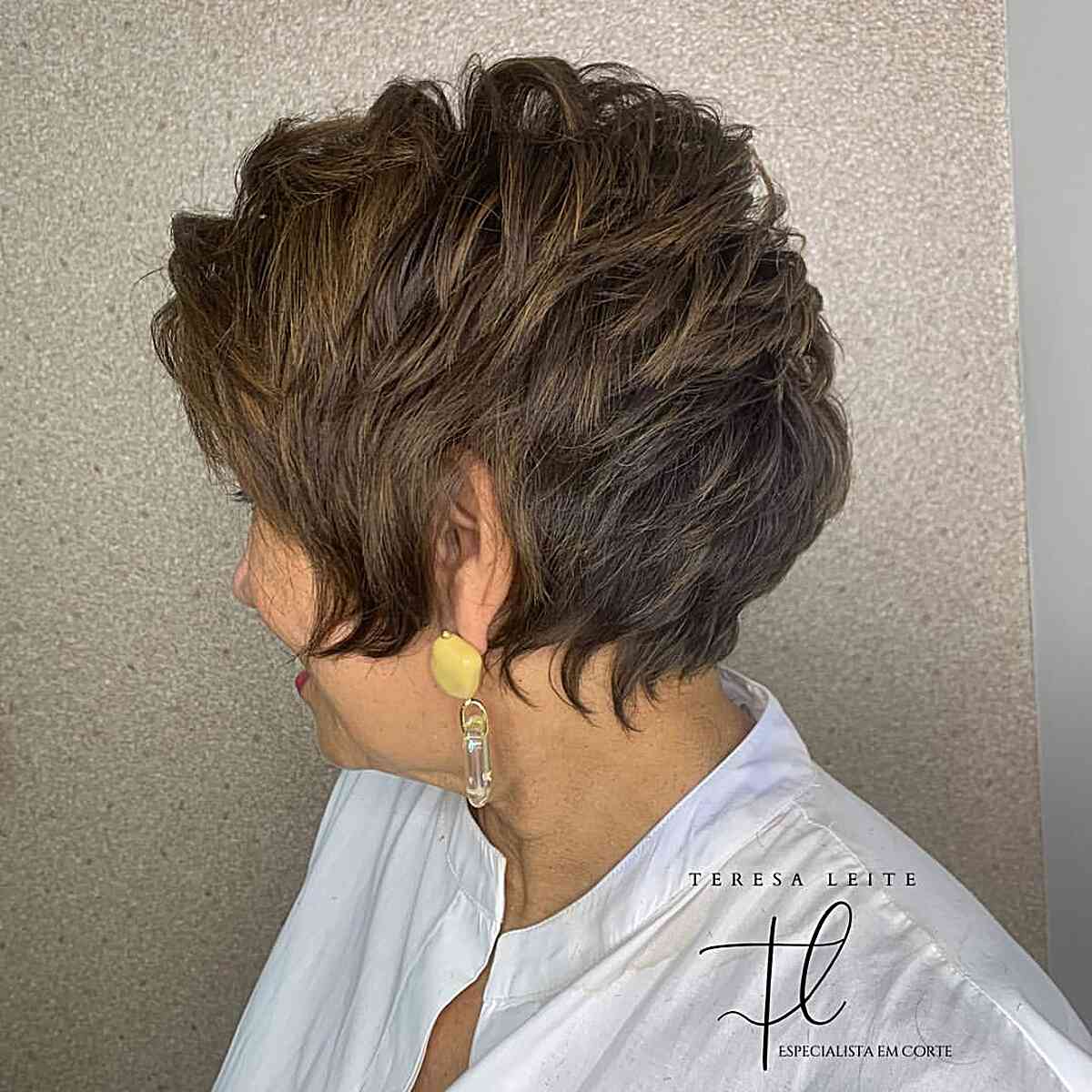 short length voluminous pixie bob with shorter layers on older ladies